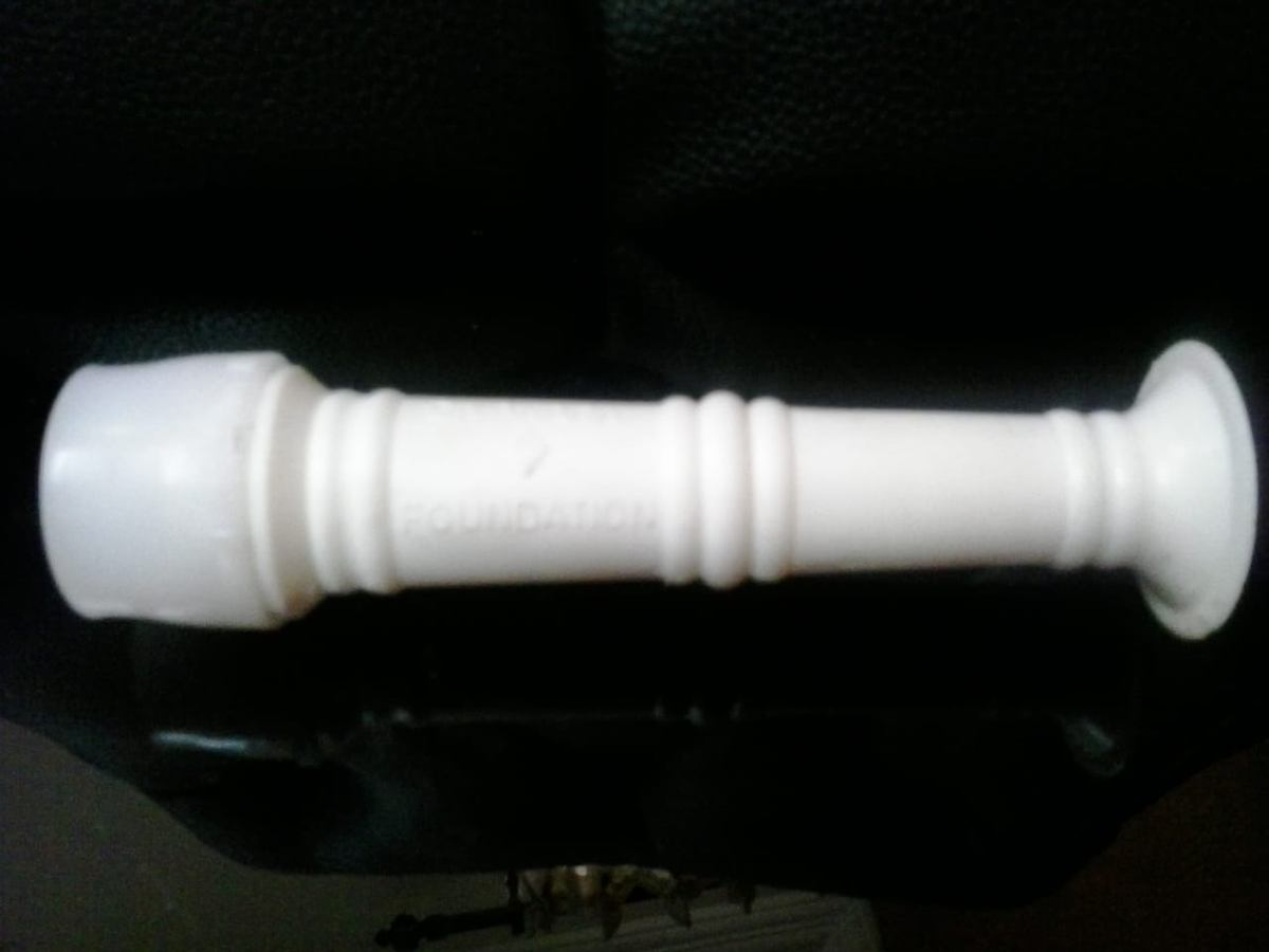 Vedadhara Bindu Nala — a precision-turned white flow-control spout for the shirodhara oil pot